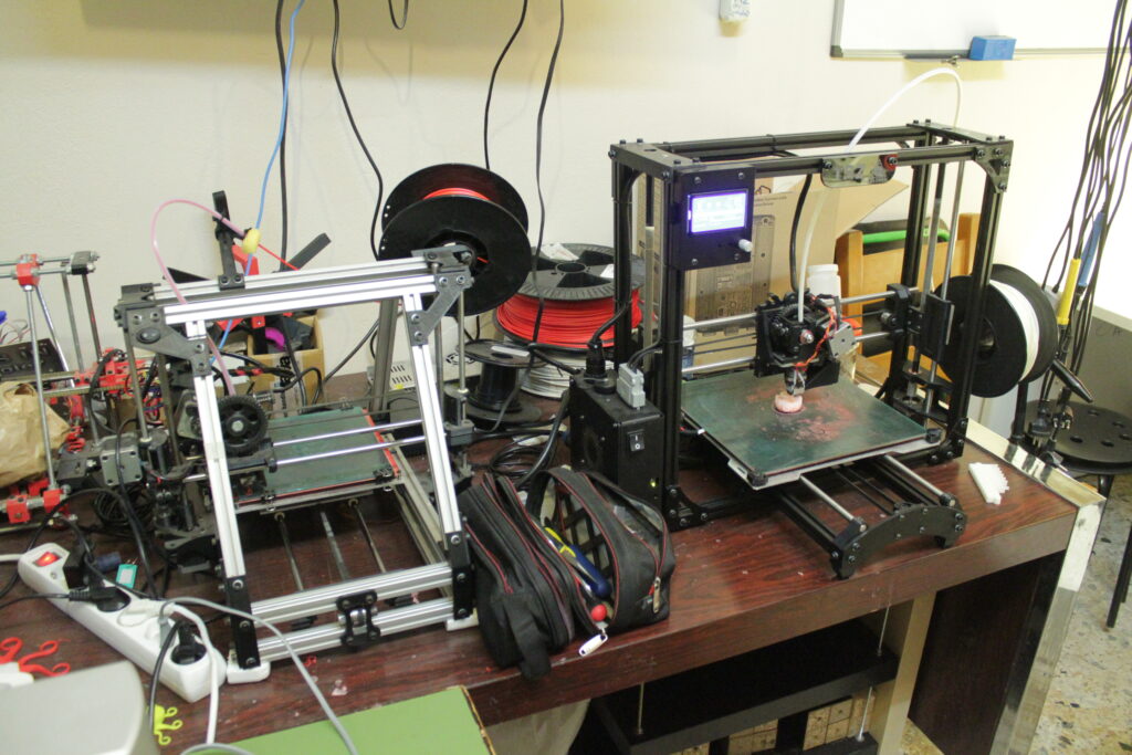 Two generations of LulzBot 3D printers